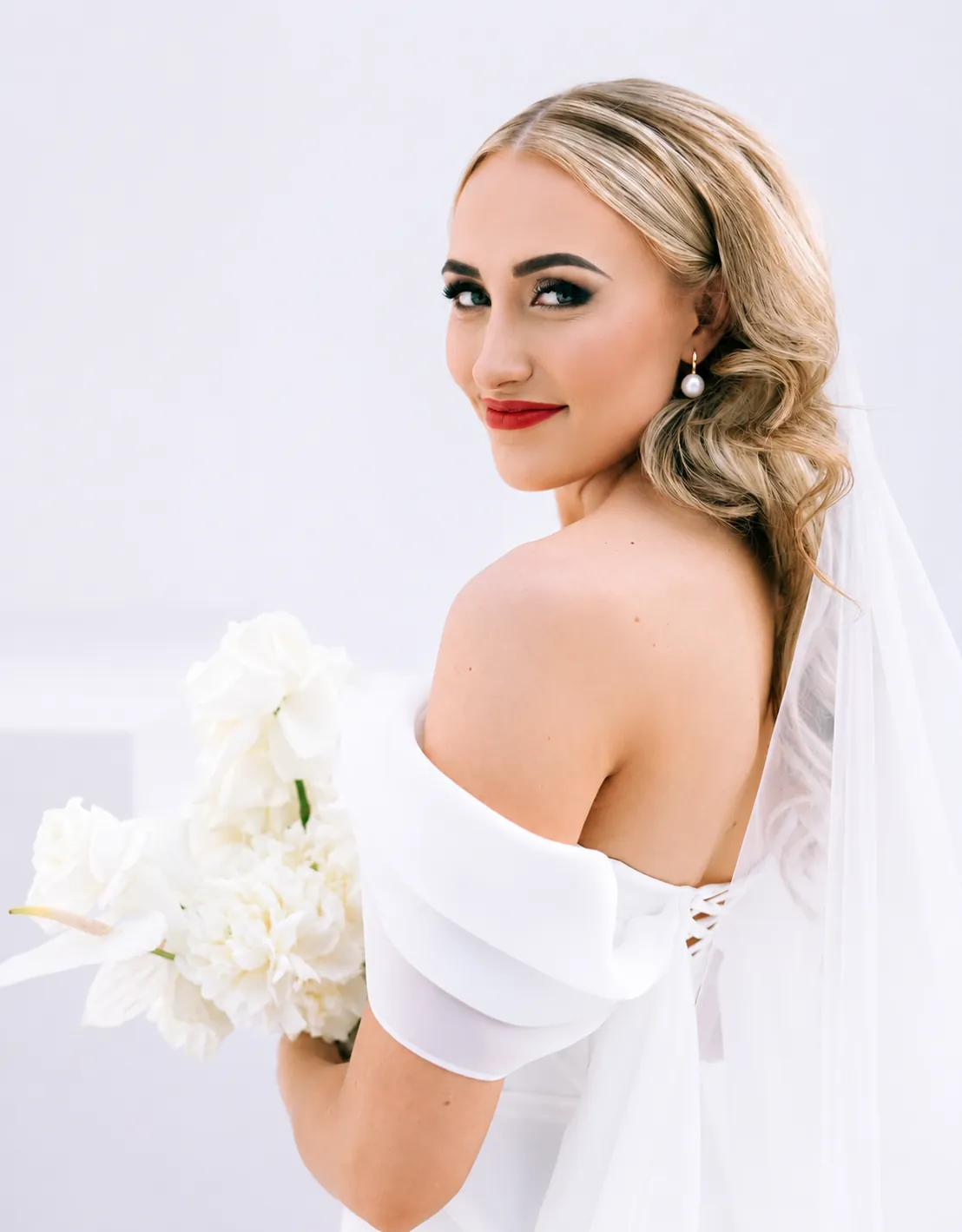 Bride holding her bouquet in an off-shoulder gown, Pretoria wedding