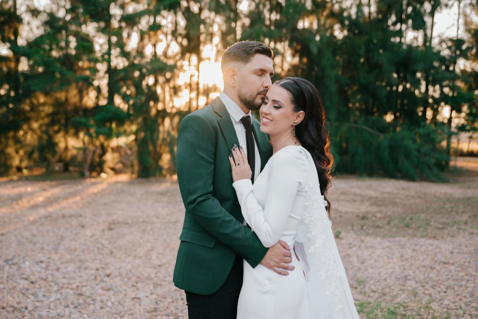 Bride and groom embracing at golden hour in a forest, Pretoria wedding