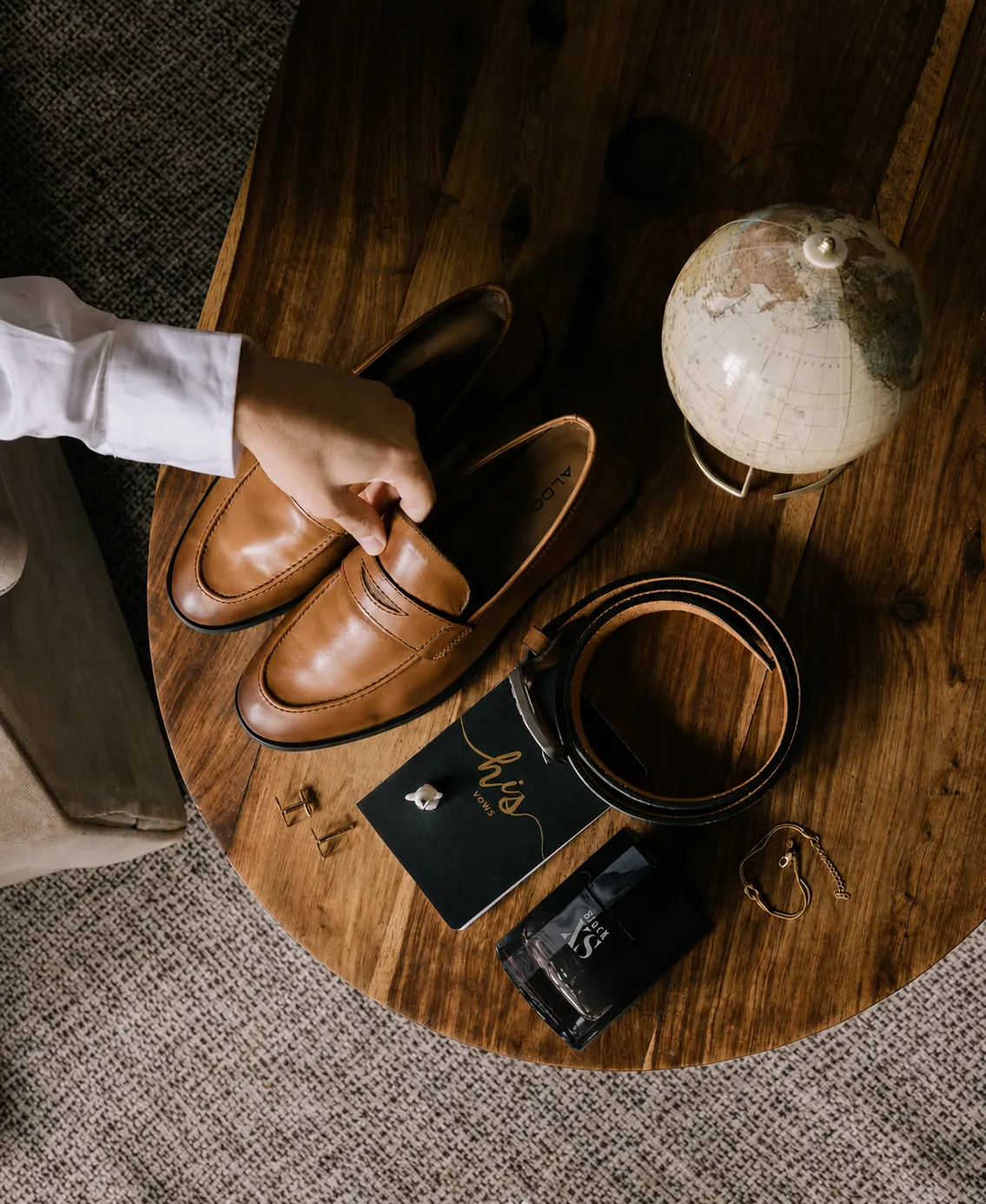 Groom's wedding day details flat lay with shoes, belt and stationery, Pretoria